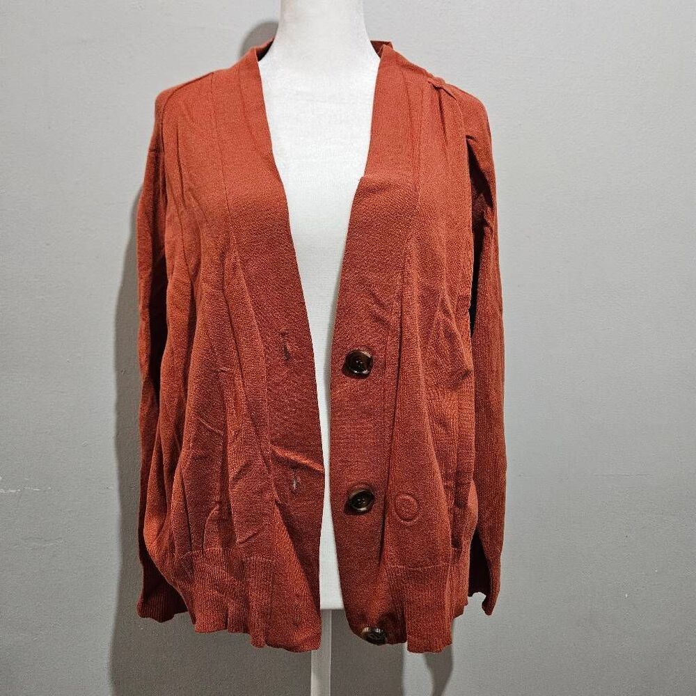 Central Park West ribbed v-neck knit cardigan styled in a deep rust or burnt ora